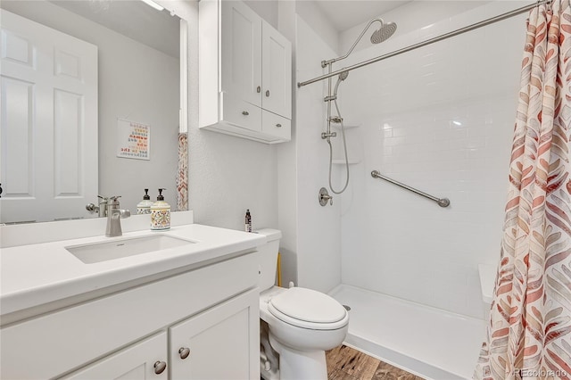 bathroom with a shower with curtain, vanity, toilet, and wood-type flooring