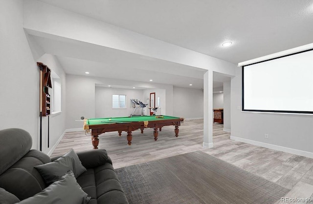 recreation room with pool table and light hardwood / wood-style flooring