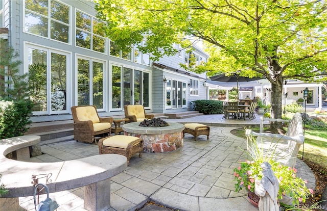 4483 W Cottonwood Pl, Littleton, CO 80123 - view of patio with an outdoor fire pit, french doors, and outdoor dining area