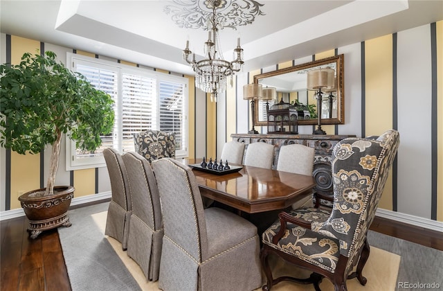 4483 W Cottonwood Pl, Littleton, CO 80123 - dining space with a chandelier, wood finished floors, and baseboards