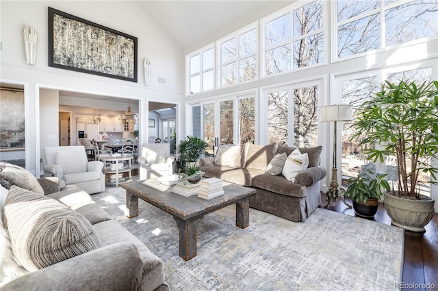 4483 W Cottonwood Pl, Littleton, CO 80123 - sunroom / solarium with vaulted ceiling and a chandelier