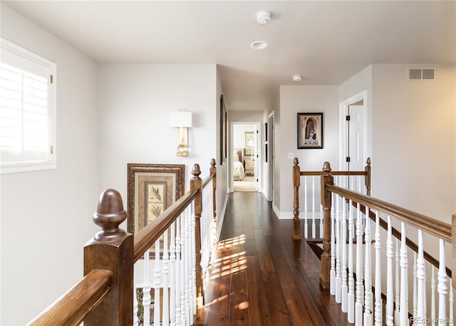 4483 W Cottonwood Pl, Littleton, CO 80123 - hallway with an upstairs landing, dark wood-style flooring, and baseboards