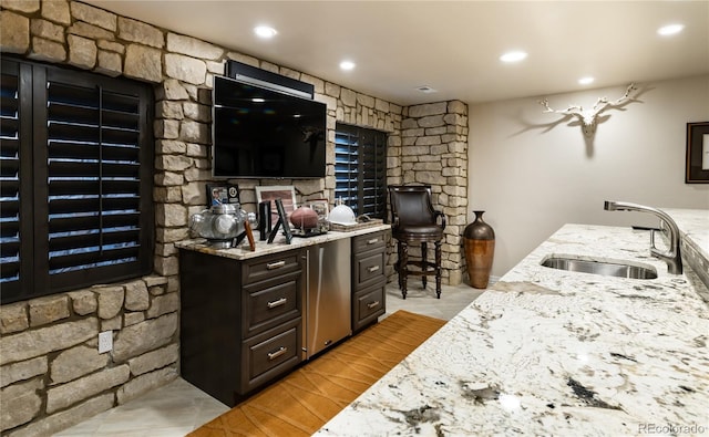4483 W Cottonwood Pl, Littleton, CO 80123 - bar area with a sink, recessed lighting, and light tile patterned floors