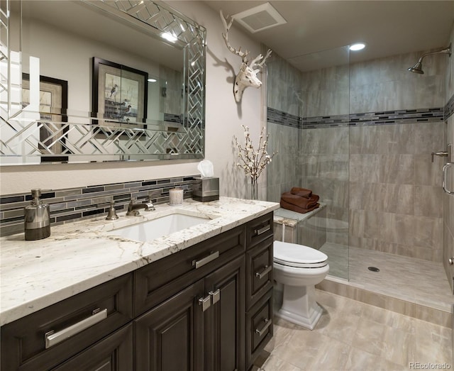 4483 W Cottonwood Pl, Littleton, CO 80123 - bathroom featuring a shower stall, toilet, tasteful backsplash, vanity, and recessed lighting