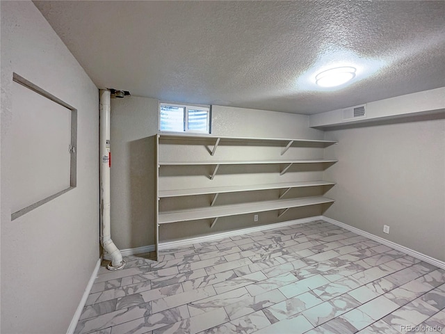 basement with a textured ceiling