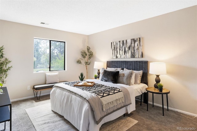 carpeted bedroom with baseboards