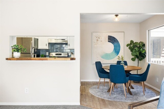 dining area featuring baseboards