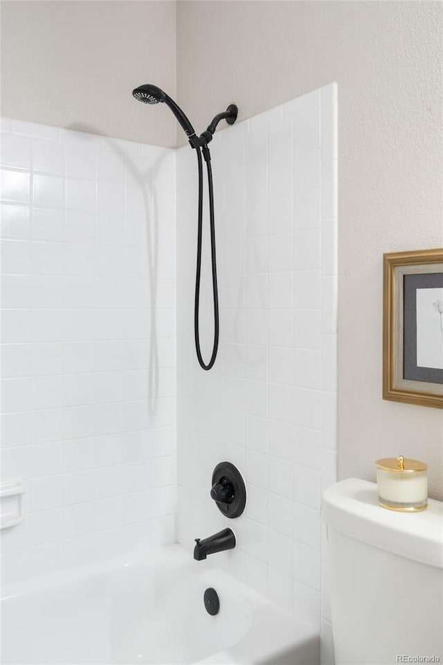 bathroom featuring  shower combination and toilet