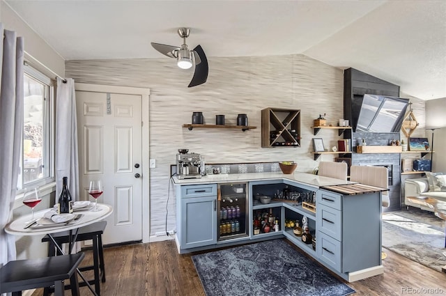4063 S Quintero Way, Aurora, CO 80013 - indoor dry bar featuring lofted ceiling, dark wood-style flooring, and ceiling fan