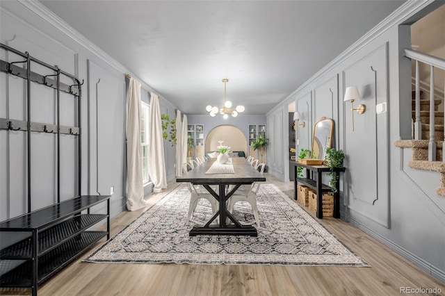 16051 E Alabama Dr, Aurora, CO 80017 - dining area featuring stairway, a chandelier, light wood-style floors, and crown molding