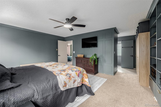 16051 E Alabama Dr, Aurora, CO 80017 - bedroom with light carpet, a textured ceiling, a ceiling fan, and ornamental molding