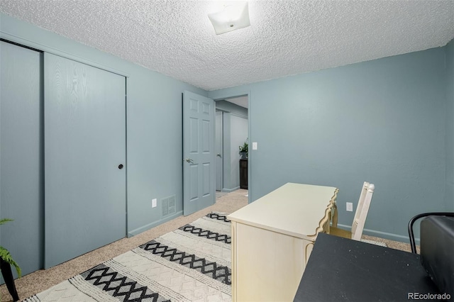 16051 E Alabama Dr, Aurora, CO 80017 - carpeted home office featuring a textured ceiling and baseboards