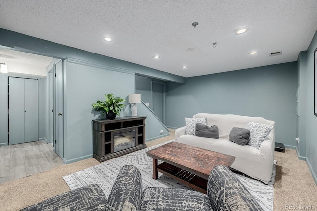 16051 E Alabama Dr, Aurora, CO 80017 - living room with a textured ceiling, recessed lighting, and carpet flooring