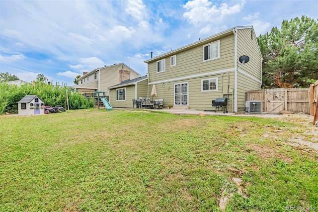 16051 E Alabama Dr, Aurora, CO 80017 - rear view of property with a playground, a patio area, a storage shed, and a gate