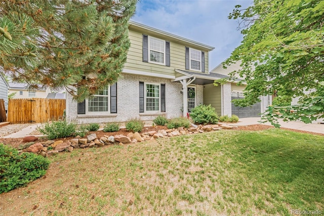 16051 E Alabama Dr, Aurora, CO 80017 - view of front of house with brick siding and a garage