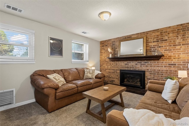 living area with a fireplace, baseboards, and visible vents