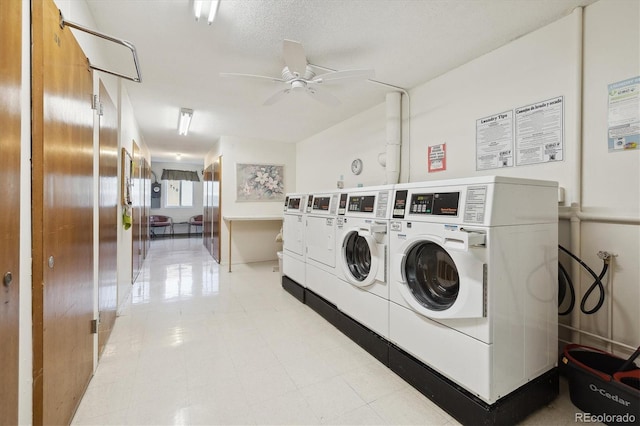 laundry area featuring washer and dryer, a textured ceiling, and ceiling fan