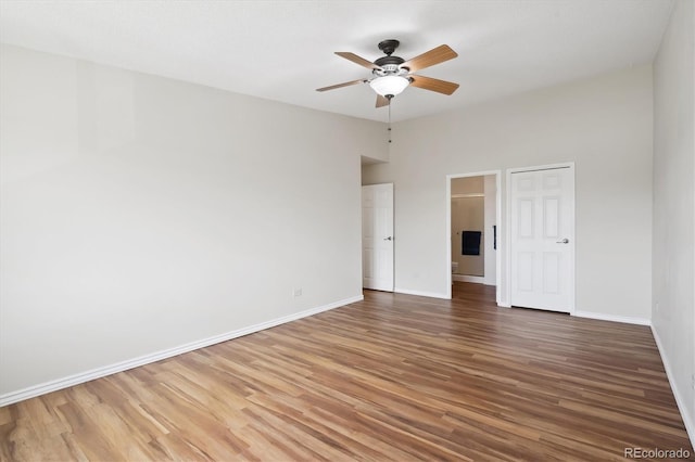 unfurnished bedroom with baseboards, a ceiling fan, and wood finished floors