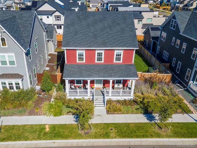 6288 N Dallas St, Denver, CO 80238 - view of front facade featuring a shingled roof, a residential view, and a porch