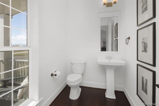 6288 N Dallas St, Denver, CO 80238 - bathroom featuring toilet and wood finished floors