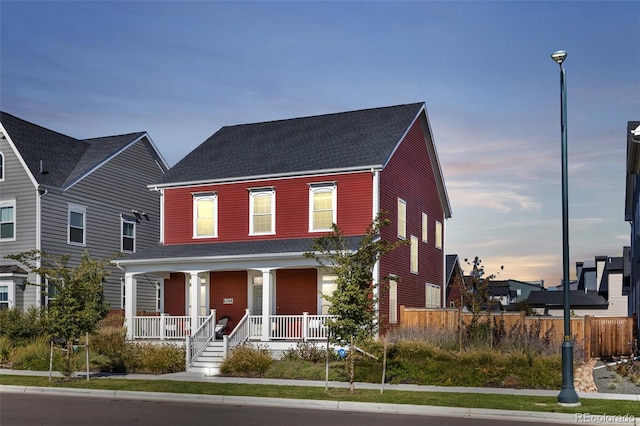 6288 N Dallas St, Denver, CO 80238 - view of front of home featuring covered porch and a shingled roof