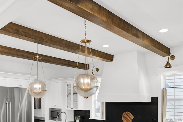 6288 N Dallas St, Denver, CO 80238 - detailed view of built in appliances, beamed ceiling, and a chandelier