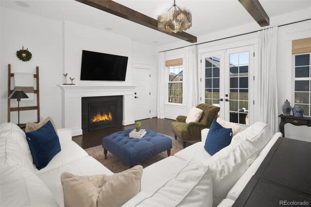 6288 N Dallas St, Denver, CO 80238 - living area with beamed ceiling, french doors, wood finished floors, a chandelier, and a glass covered fireplace