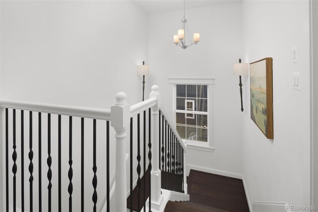 6288 N Dallas St, Denver, CO 80238 - stairway featuring a chandelier and wood finished floors