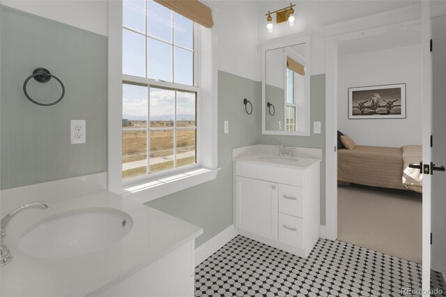 6288 N Dallas St, Denver, CO 80238 - ensuite bathroom featuring two vanities and tile patterned floors