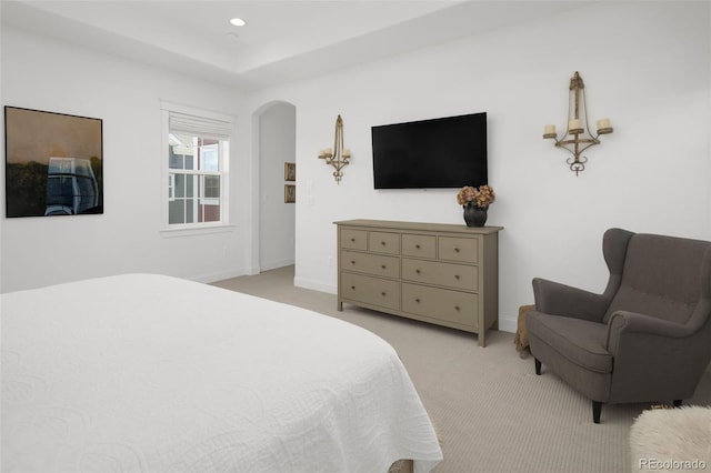6288 N Dallas St, Denver, CO 80238 - bedroom featuring light carpet, arched walkways, and recessed lighting
