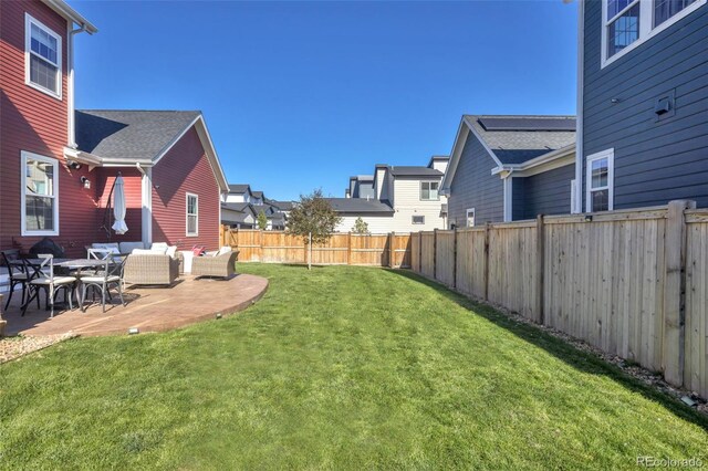 6288 N Dallas St, Denver, CO 80238 - fenced backyard featuring a patio area and an outdoor hangout area