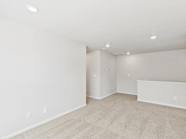 empty room with carpet, baseboards, and recessed lighting