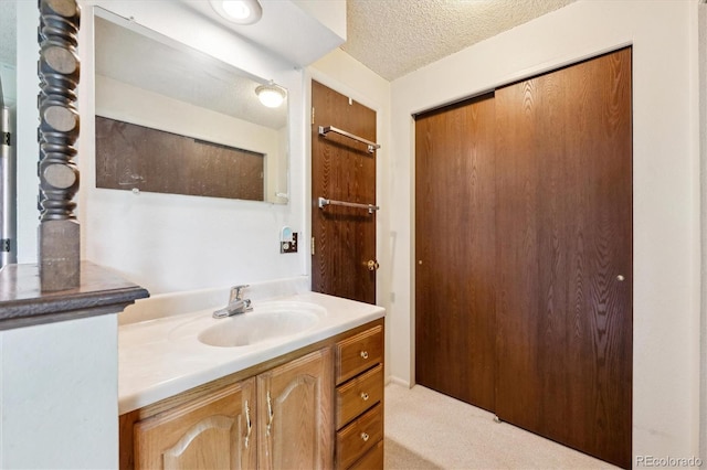 8552 Gray Ct, Arvada, CO 80003 - bathroom with vanity and a textured ceiling