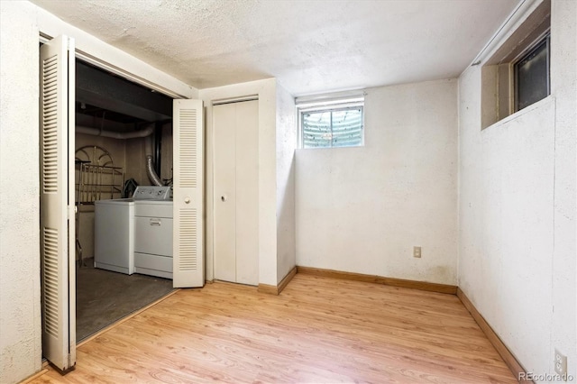 8552 Gray Ct, Arvada, CO 80003 - laundry area featuring independent washer and dryer, light wood-type flooring, and baseboards
