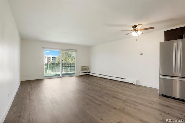 interior space with light hardwood / wood-style flooring, ceiling fan, a baseboard radiator, and a wall mounted AC