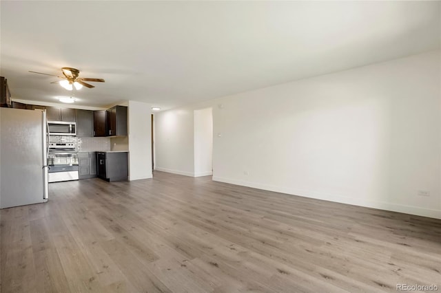 unfurnished living room with light hardwood / wood-style flooring and ceiling fan