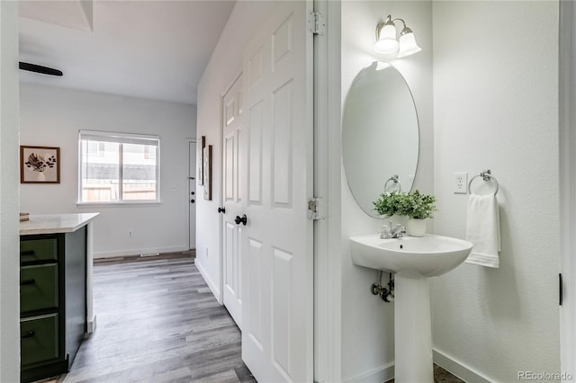 2642 Devonshire Ct, Denver, CO 80229 - bathroom with wood finished floors and baseboards