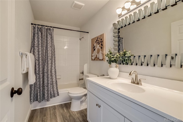 2642 Devonshire Ct, Denver, CO 80229 - bathroom with vanity, wood finished floors, shower / bathtub combination with curtain, and toilet