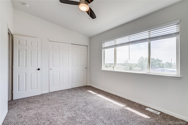 2642 Devonshire Ct, Denver, CO 80229 - unfurnished bedroom featuring carpet, vaulted ceiling, a closet, baseboards, and ceiling fan