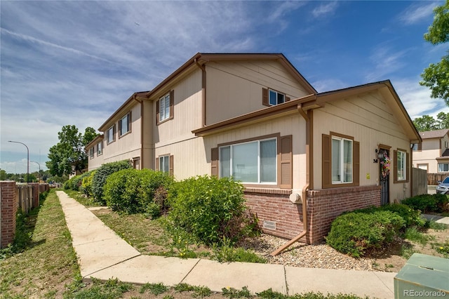 2642 Devonshire Ct, Denver, CO 80229 - view of side of home featuring brick siding