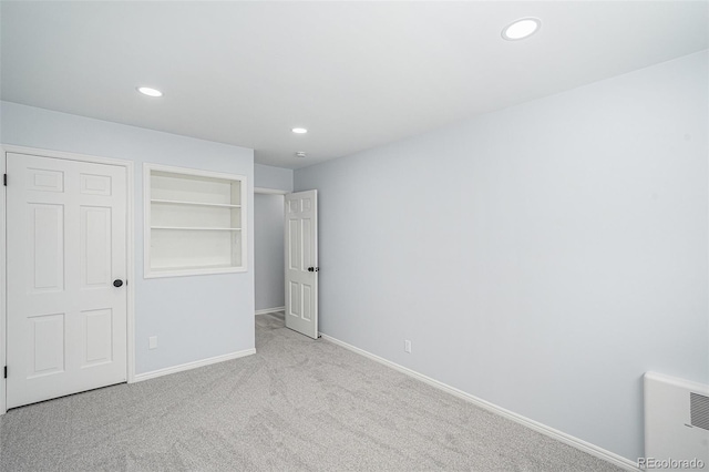 unfurnished bedroom featuring recessed lighting, carpet flooring, and baseboards