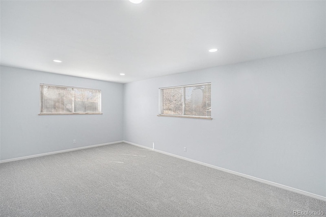 carpeted spare room with baseboards and recessed lighting