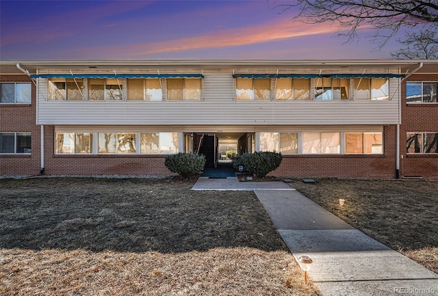 exterior space with brick siding