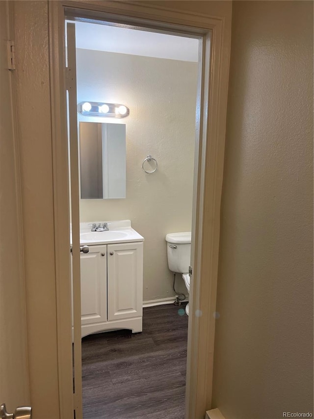 14704 E 2nd Ave Unit 300E, Aurora, CO 80011 - bathroom featuring wood finished floors and vanity