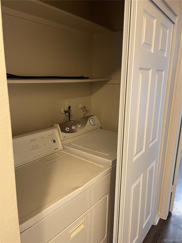 14704 E 2nd Ave Unit 300E, Aurora, CO 80011 - washroom with washer and dryer and dark wood-type flooring
