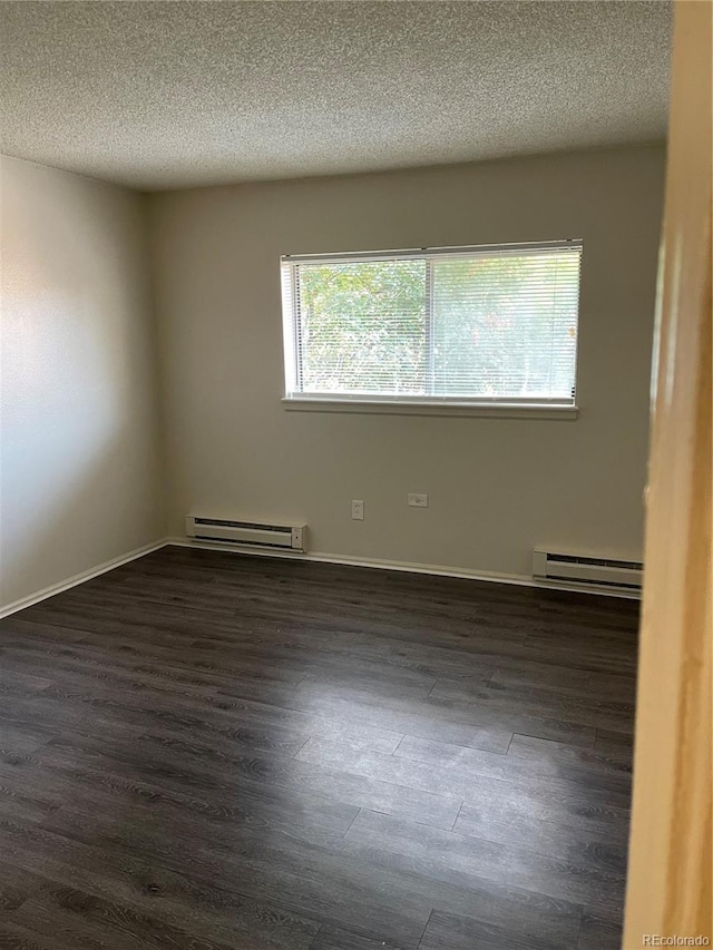 14704 E 2nd Ave Unit 300E, Aurora, CO 80011 - empty room with dark wood-type flooring, healthy amount of natural light, a textured ceiling, and a baseboard radiator