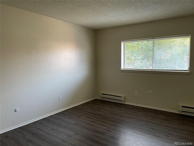 14704 E 2nd Ave Unit 300E, Aurora, CO 80011 - spare room with dark wood-type flooring, a textured ceiling, and a baseboard radiator