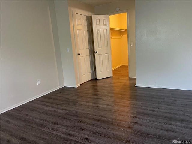 14704 E 2nd Ave Unit 300E, Aurora, CO 80011 - unfurnished bedroom with dark wood-style floors and baseboards