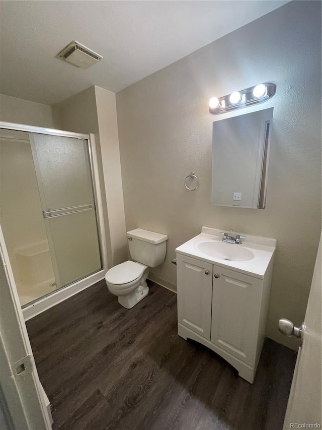 14704 E 2nd Ave Unit 300E, Aurora, CO 80011 - full bath featuring wood finished floors, vanity, and a shower stall