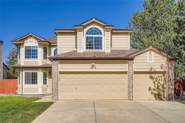 5370 S Jebel St, Centennial, CO 80015 - traditional-style home featuring concrete driveway, a shingled roof, and a garage